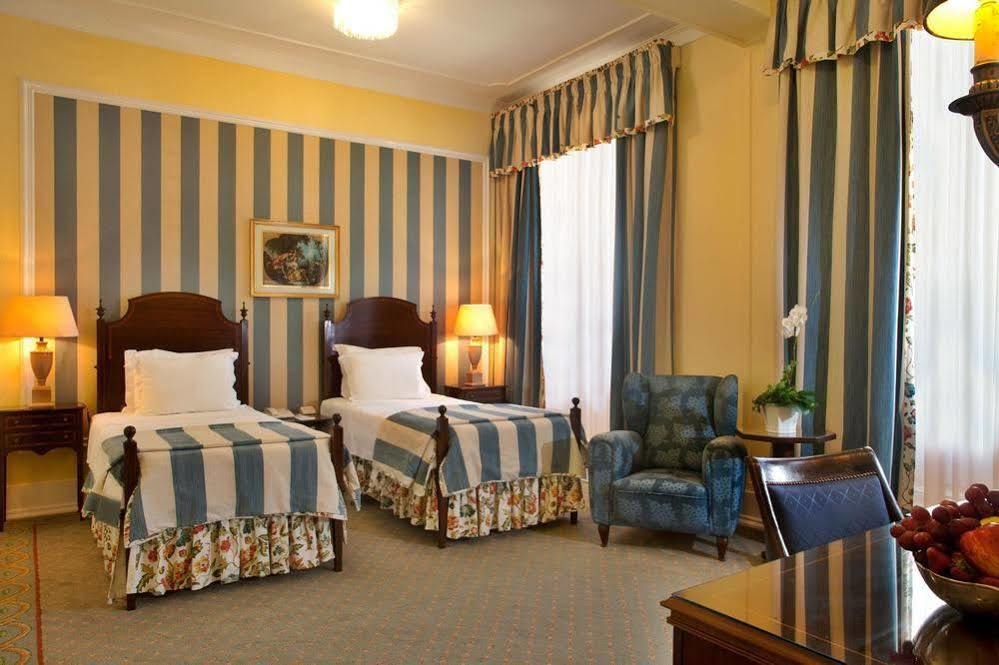 Hotel Avenida Palace Lisboa Exterior foto A room at the hotel